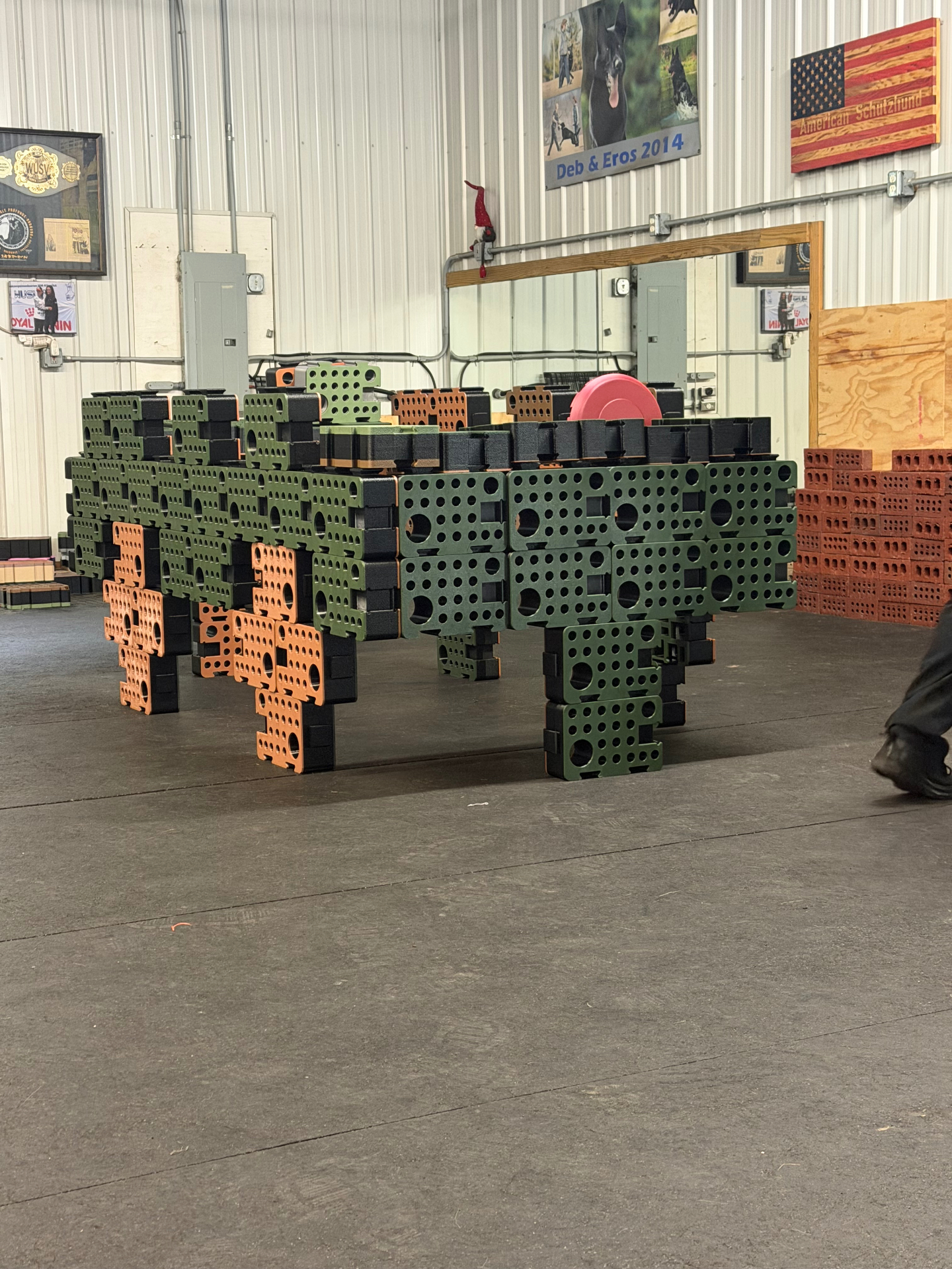 Green, orange and black D-Blocks built into a vehicle-shaped search problem in a training facility
